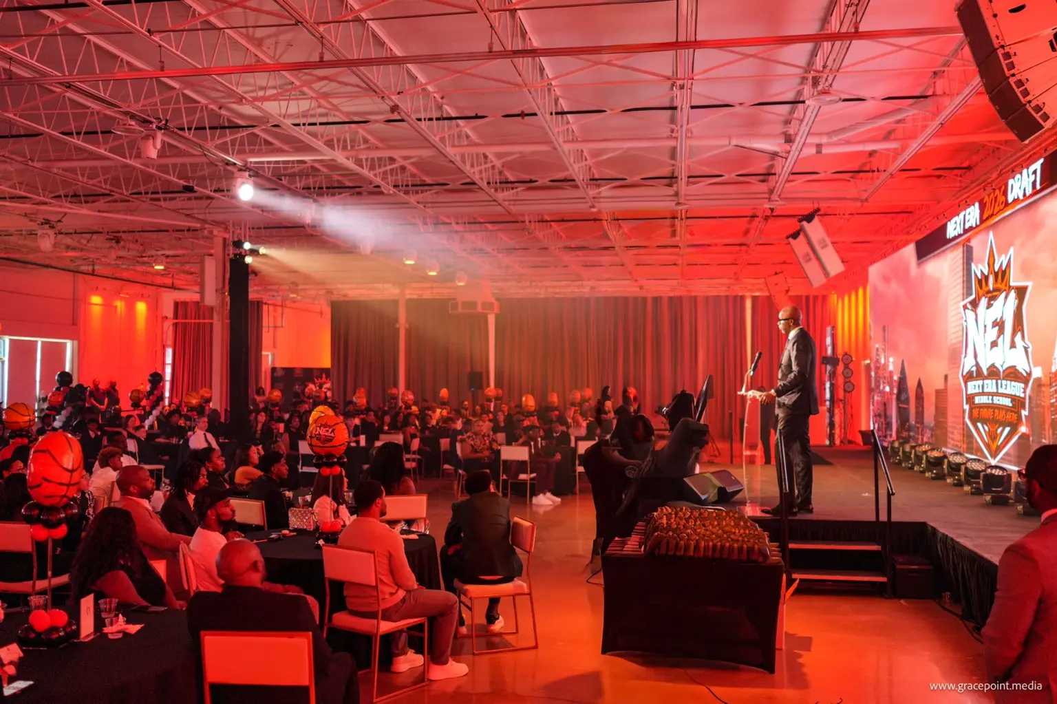A wide view of the Draft Night audience and Next Era League stage