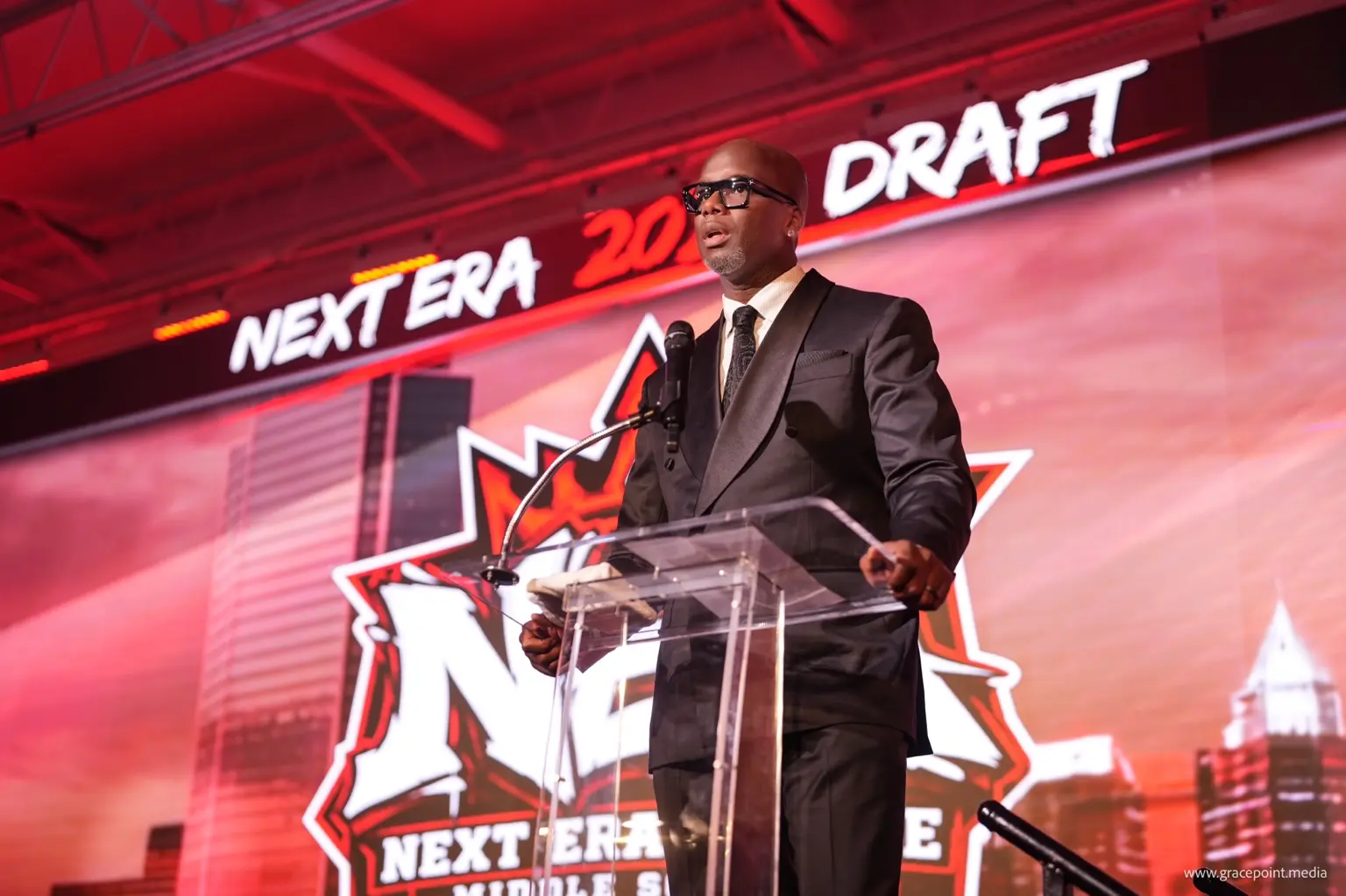 League founder speaking from the Draft Night podium