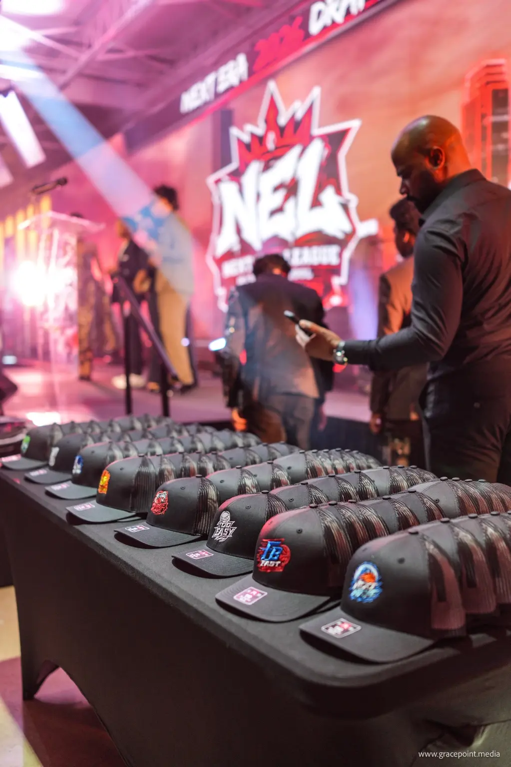 Official team hats arranged for players at the Next Era League Draft